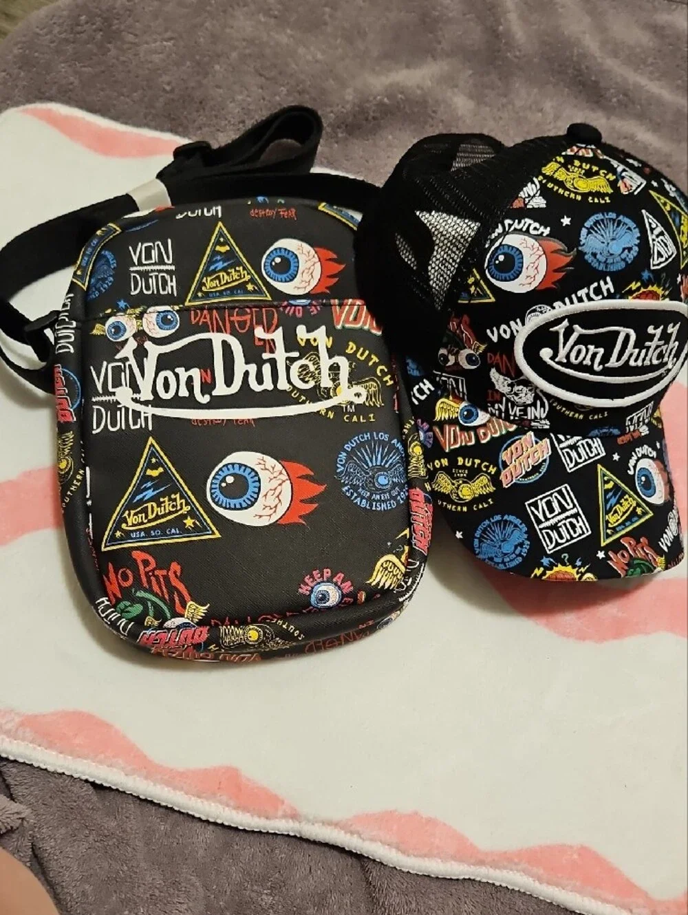 Von Dutch Black Crossbody Bag with Colorful Graphic Accents 2 Piece Bag And Hat
